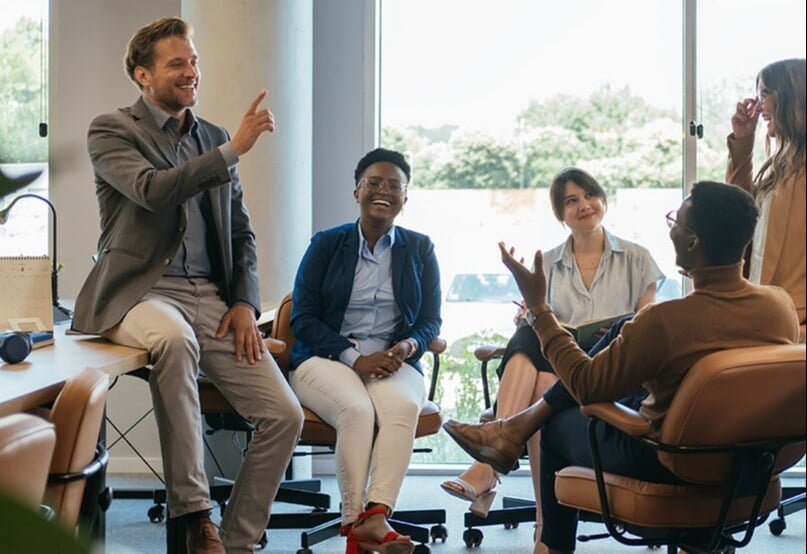 coworkers-sit-around-casually-meeting